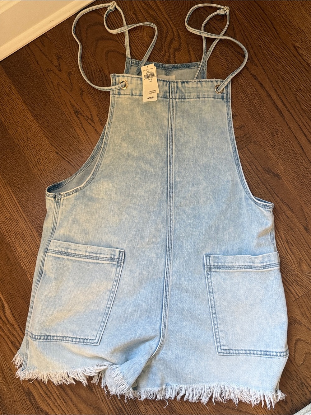 Light Blue Denim Romper Overalls with Frayed Hem